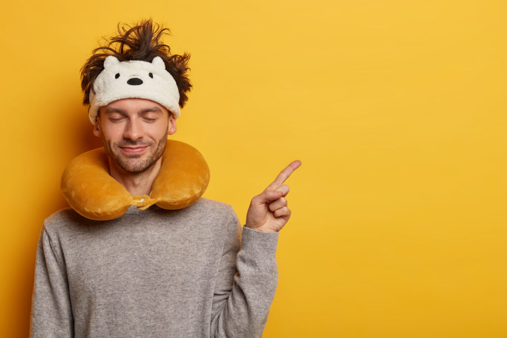 A traveler with neck pillow